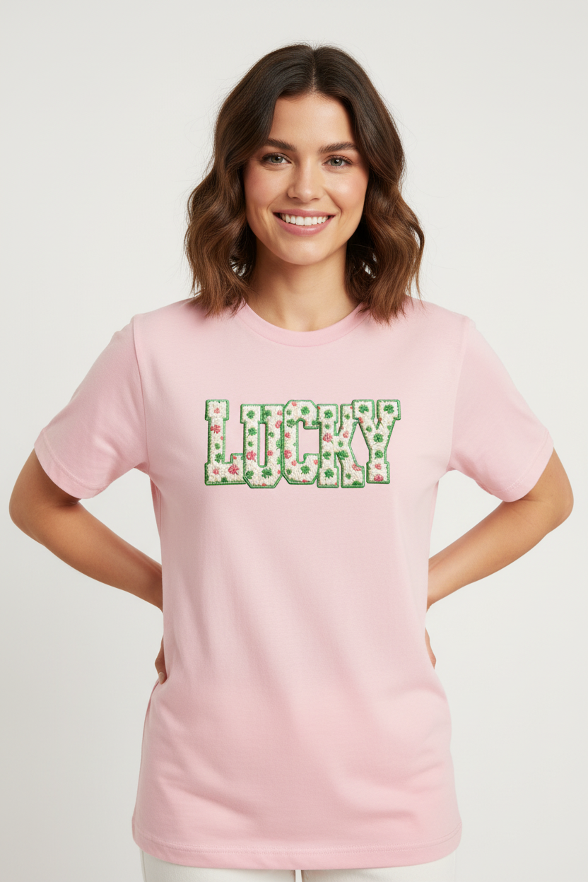 Woman wearing pink t-shirt with Lucky clover design